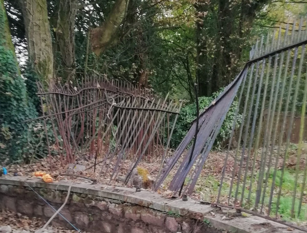 The fence has collapsed at the corner